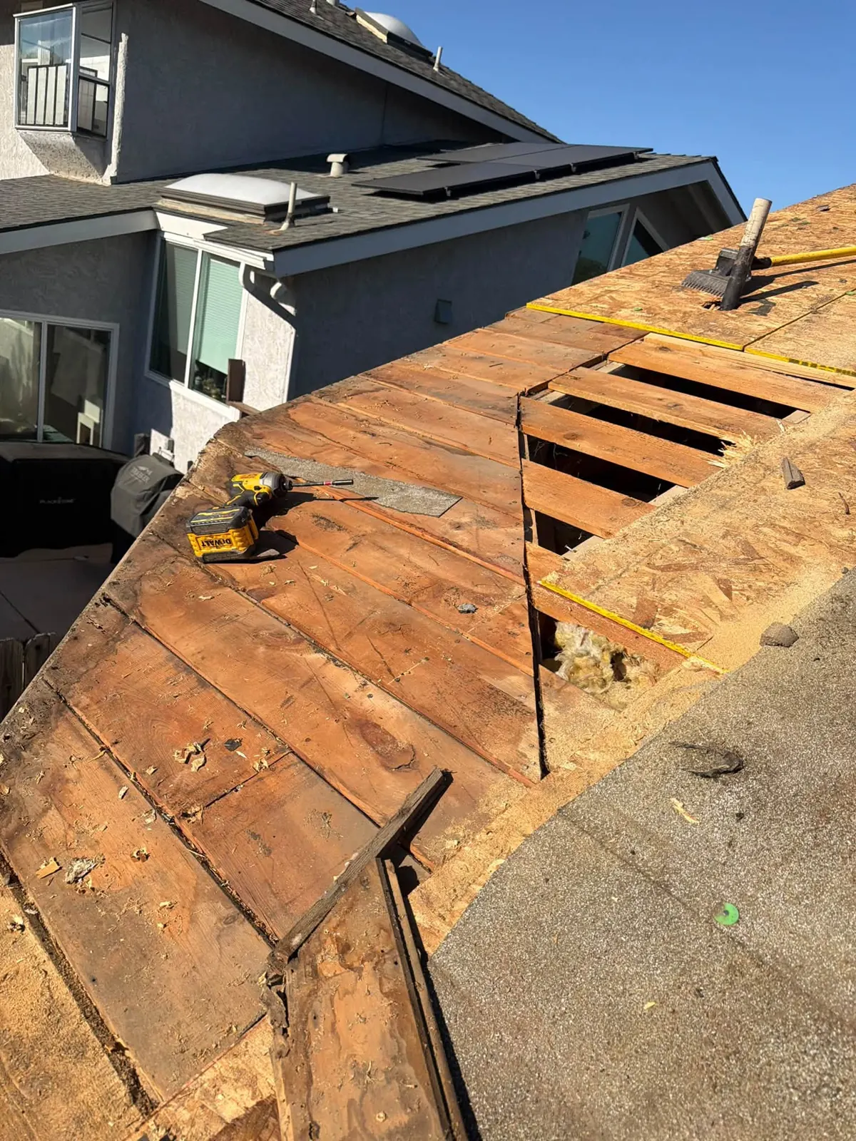 Damaged roof boards being replaced