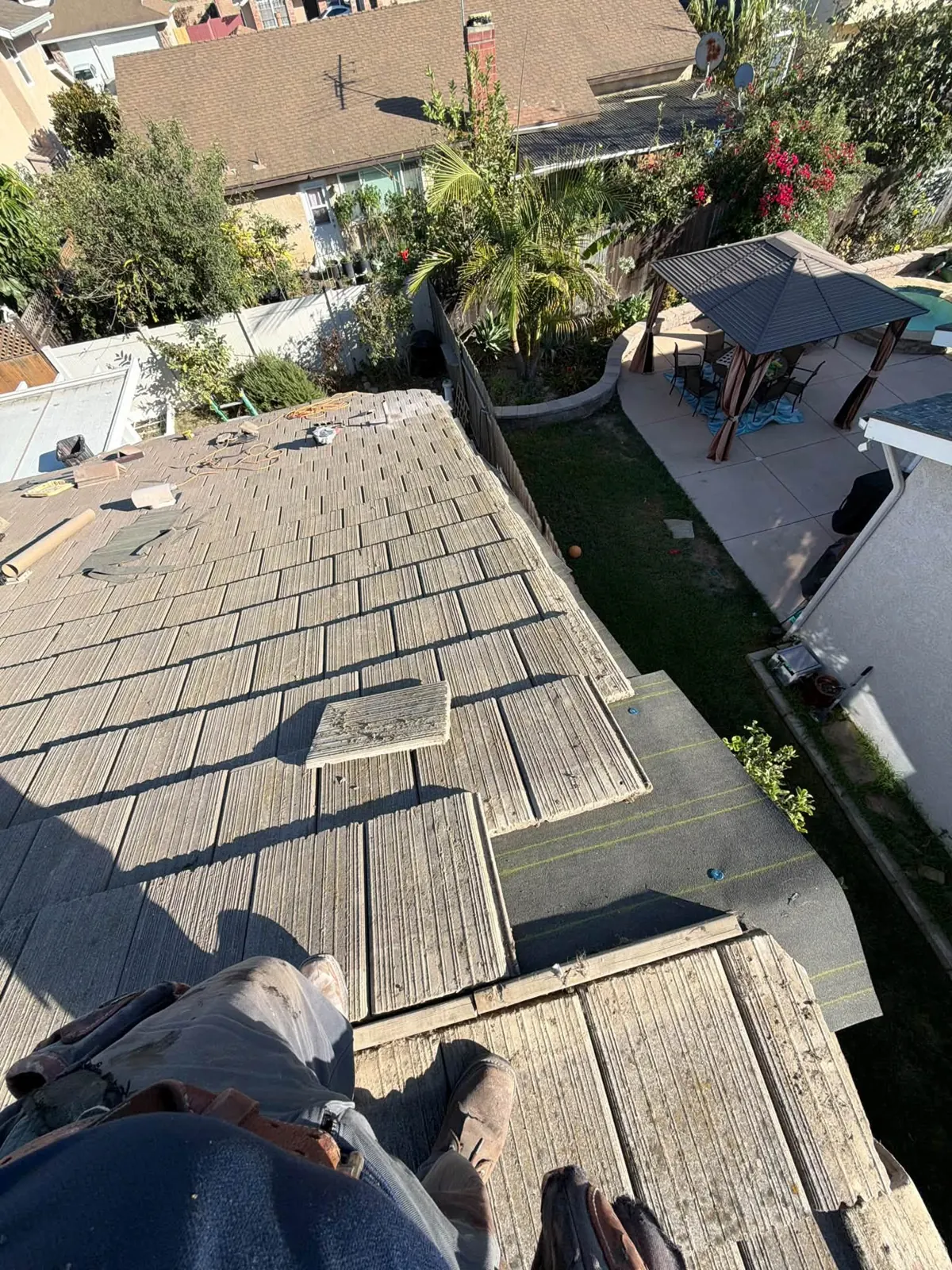 Concrete tile roof being removed